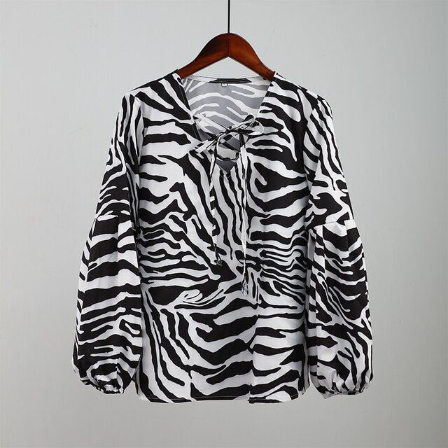 BLUSA Zebra V-neck Women Blouse Se você está procurando uma blusa versátil e estilosa que possa facilmente transitar do escritório para uma saída à noite casual.