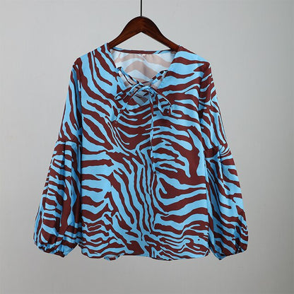 BLUSA Zebra V-neck Women Blouse Se você está procurando uma blusa versátil e estilosa que possa facilmente transitar do escritório para uma saída à noite casual.