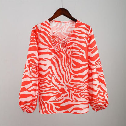 BLUSA Zebra V-neck Women Blouse Se você está procurando uma blusa versátil e estilosa que possa facilmente transitar do escritório para uma saída à noite casual.