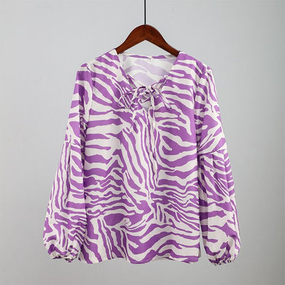 BLUSA Zebra V-neck Women Blouse Se você está procurando uma blusa versátil e estilosa que possa facilmente transitar do escritório para uma saída à noite casual.