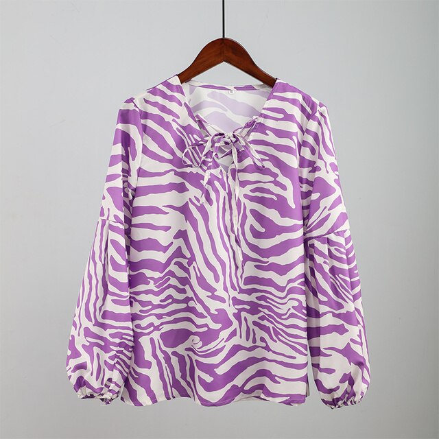 BLUSA Zebra V-neck Women Blouse Se você está procurando uma blusa versátil e estilosa que possa facilmente transitar do escritório para uma saída à noite casual.