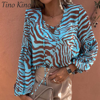 BLUSA Zebra V-neck Women Blouse Se você está procurando uma blusa versátil e estilosa que possa facilmente transitar do escritório para uma saída à noite casual.