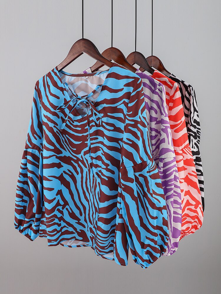 BLUSA Zebra V-neck Women Blouse Se você está procurando uma blusa versátil e estilosa que possa facilmente transitar do escritório para uma saída à noite casual.