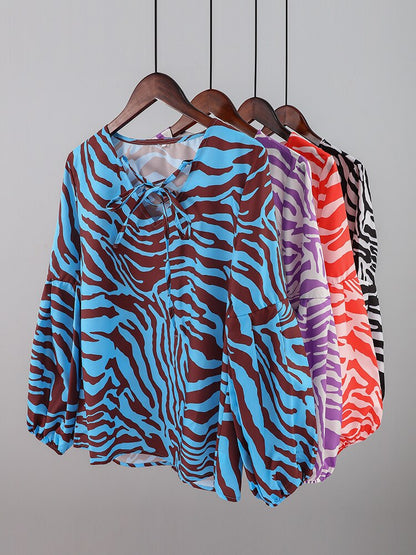 BLUSA Zebra V-neck Women Blouse Se você está procurando uma blusa versátil e estilosa que possa facilmente transitar do escritório para uma saída à noite casual.