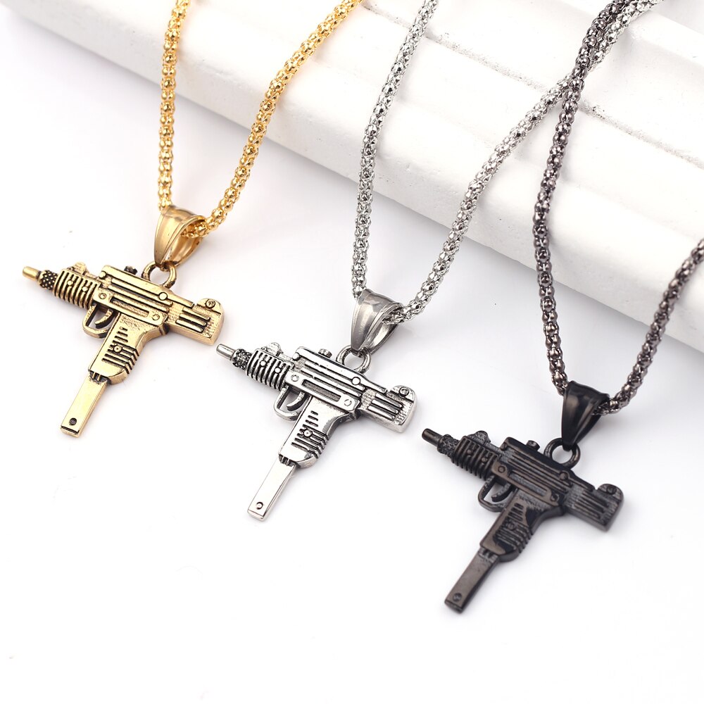 Submachine Gun Pistol Necklaces Apresentando o colar de pistola de metralhadora! Este colar elegante e exclusivo é perfeito para qualquer homem que entende de moda.