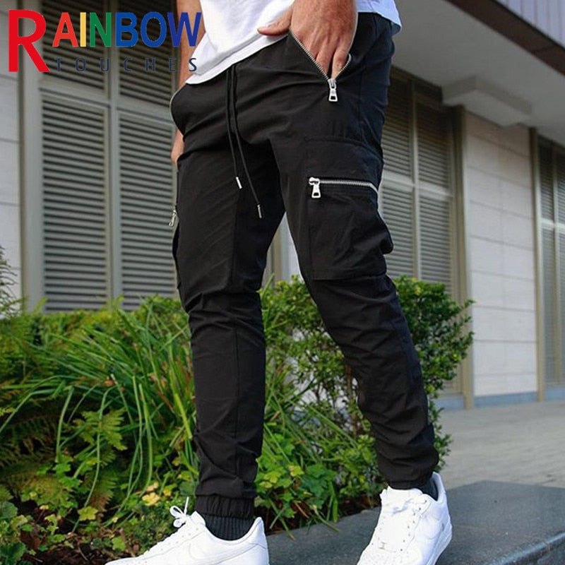 Calça Zip Pocket Men's Cargo Pants calça cargo versátil e estilosa que possa levá-lo da academia para a rua? Não procure mais, nossas calças cargo masculinas com bolso com zíper.